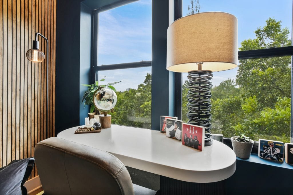 Curved desk styled in a home office by Decorilla designer, Marve M.