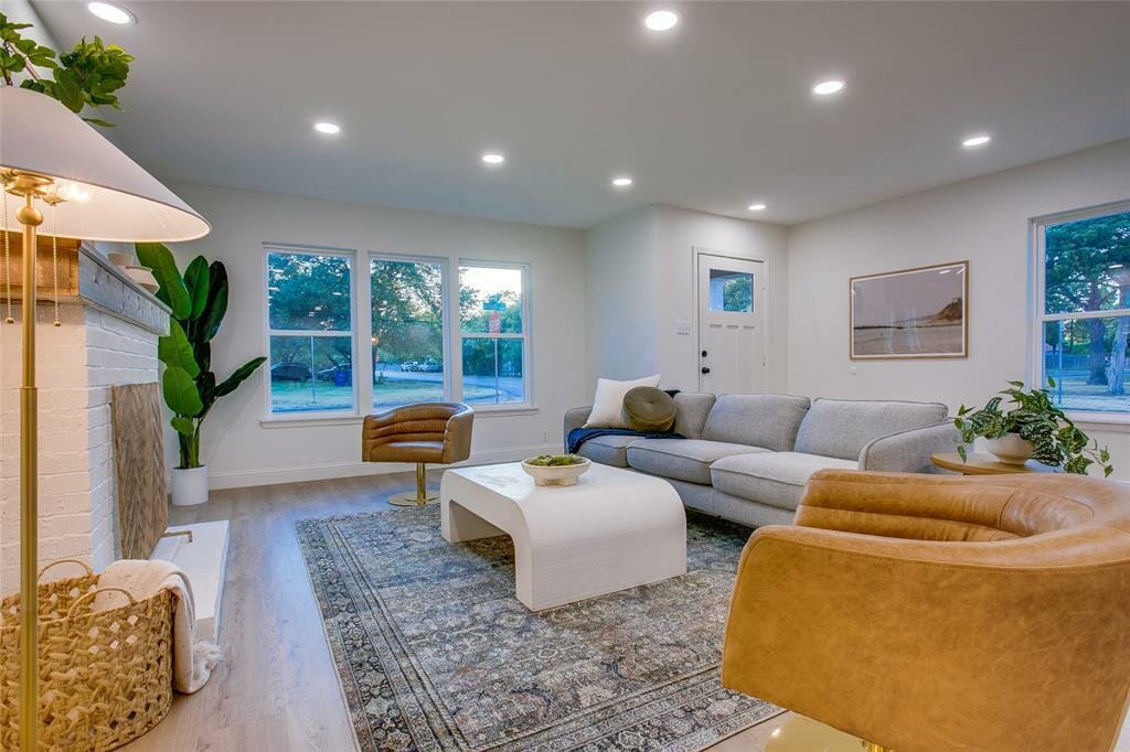 Eclectic living room with a curved coffee table by Decorilla designer, Ivonne O.