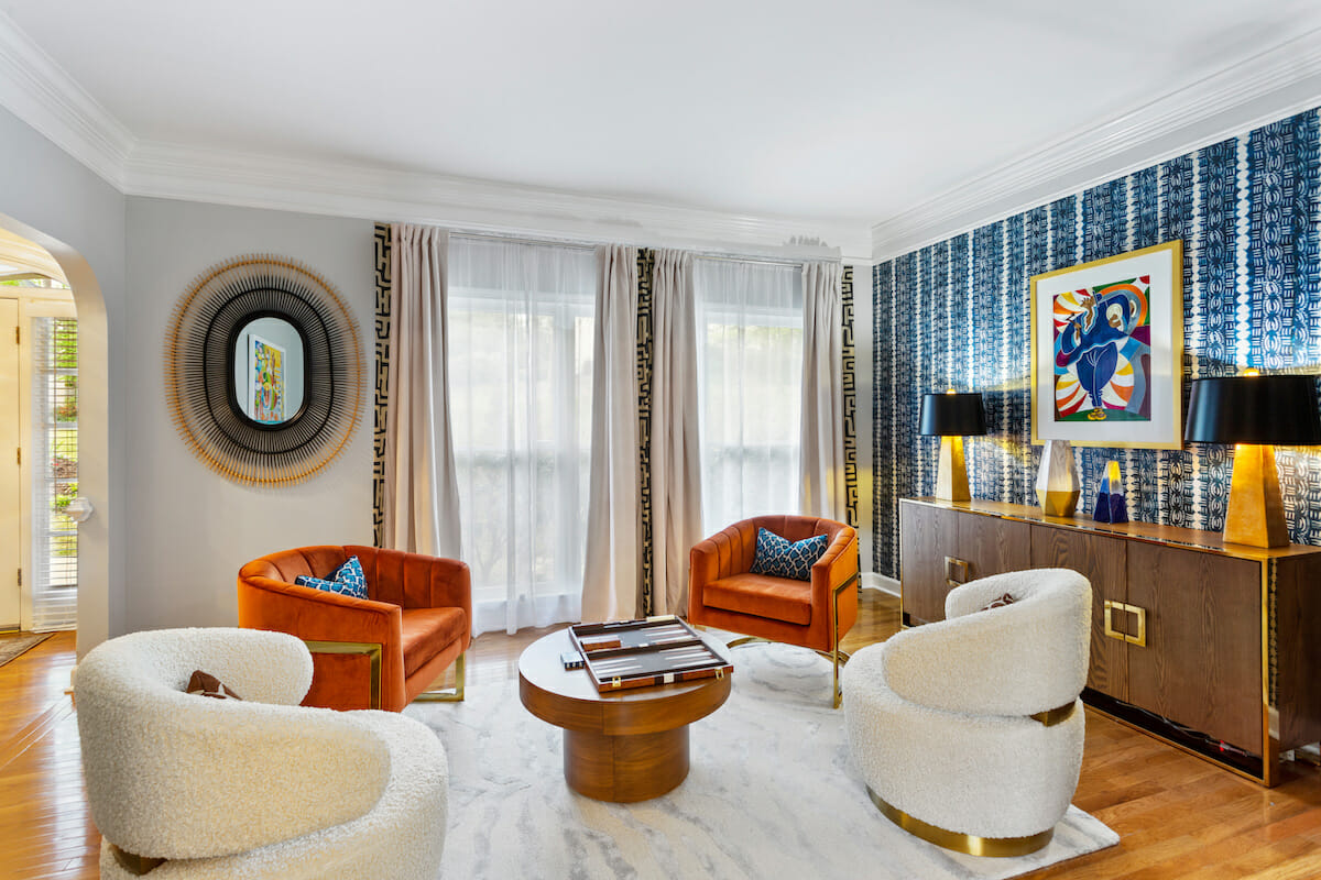 Eclectic living room with curved accent chairs by Decorilla designer, Sierra G.