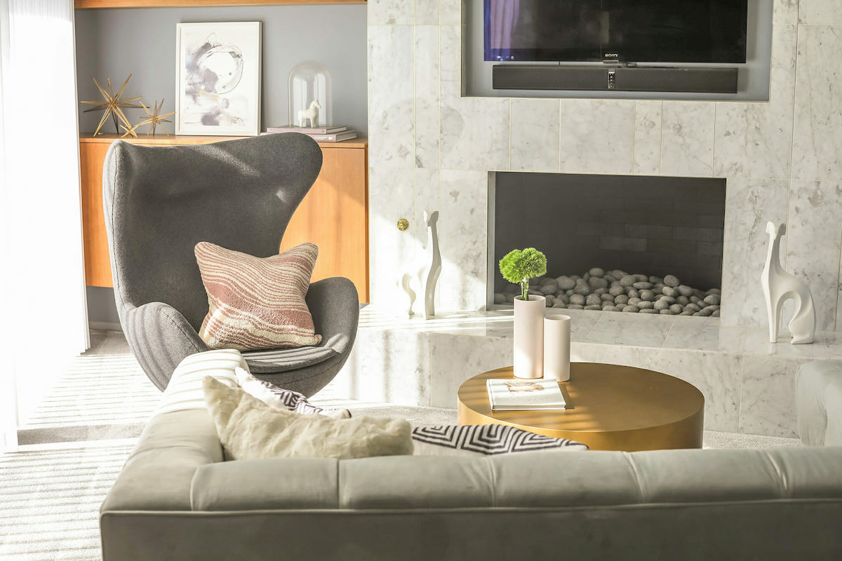 Mid-century modern curved accent chair by Decorilla designer, Michelle B.