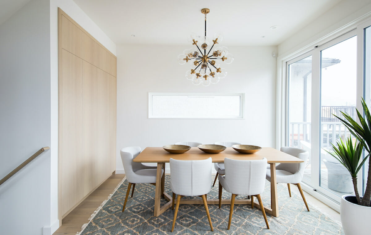 Styled room with Scandinavian dining table set by Decorilla designer Dina H.