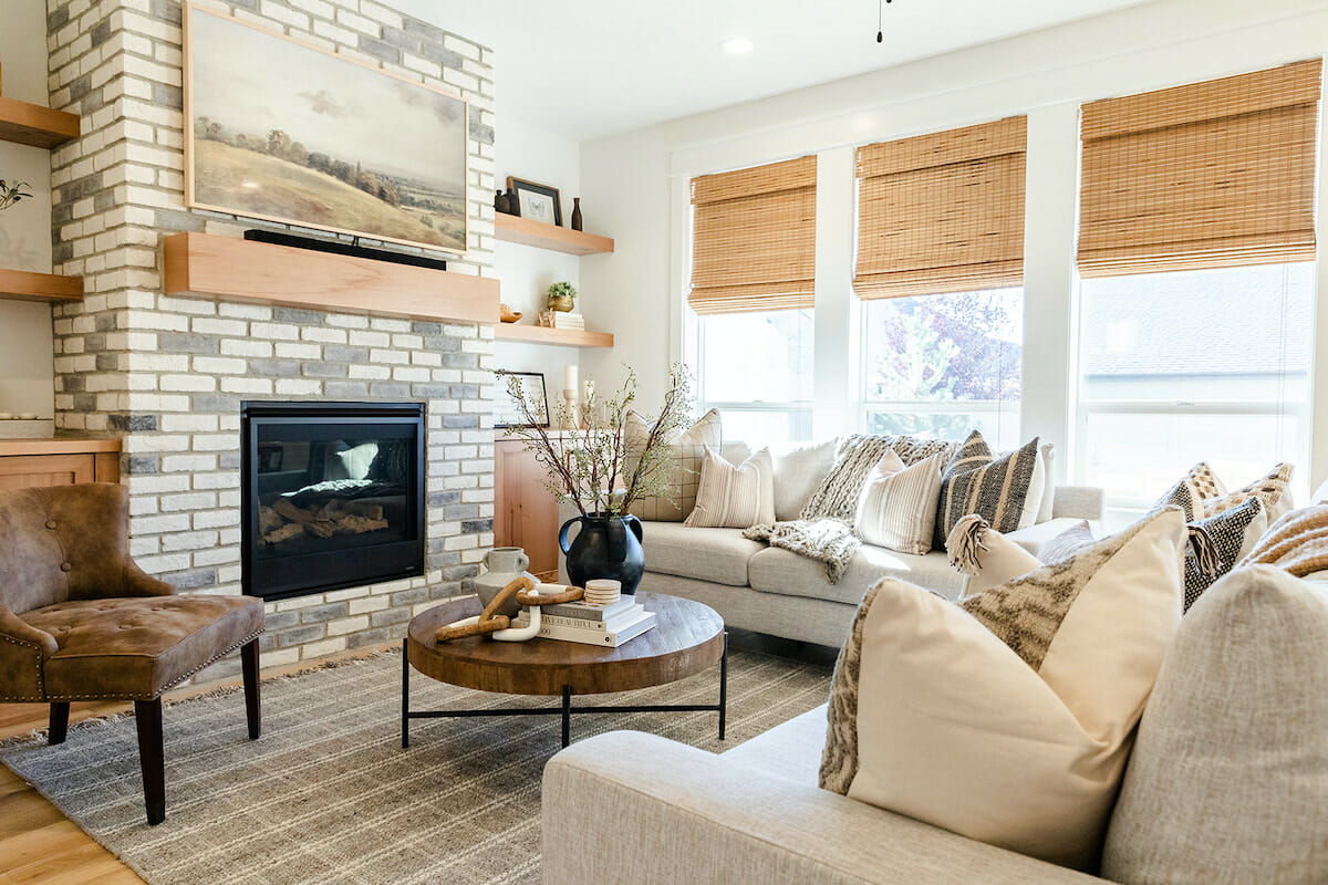 Seating arrangement around a fireplace by Decorilla designer, Sharene M.