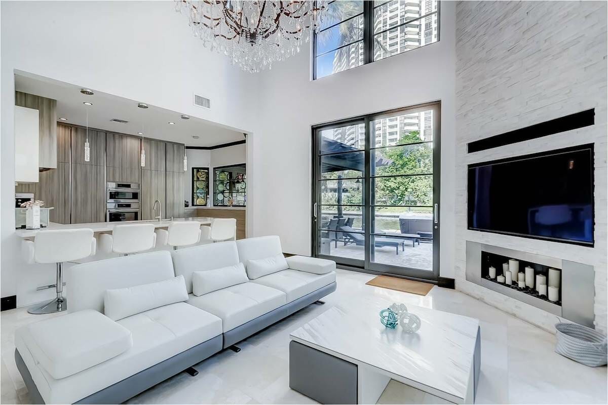White leather sofa living room idea by Decorilla designer Meral Y.