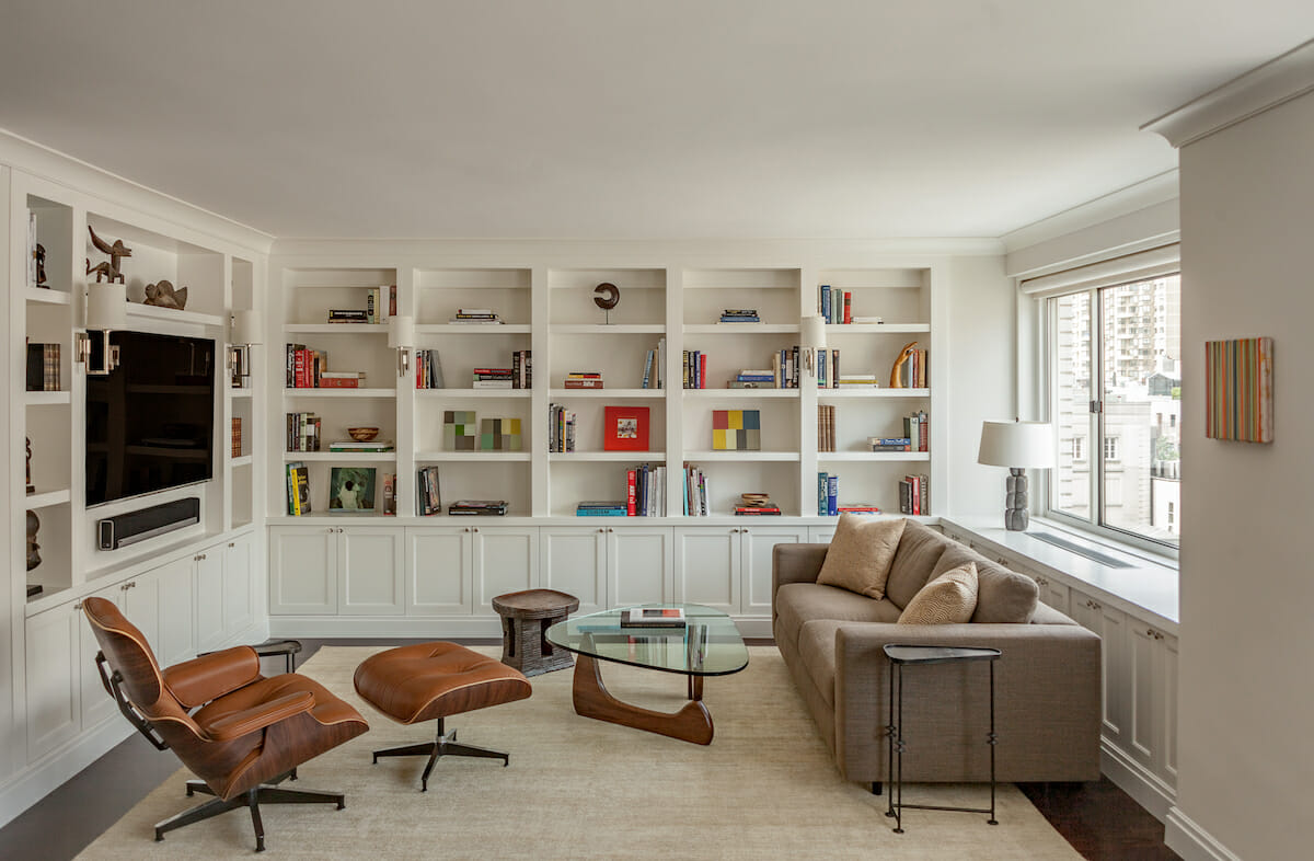 Bookshelves with pops of color as dopamine decor by Decorilla designer, Leonora M.
