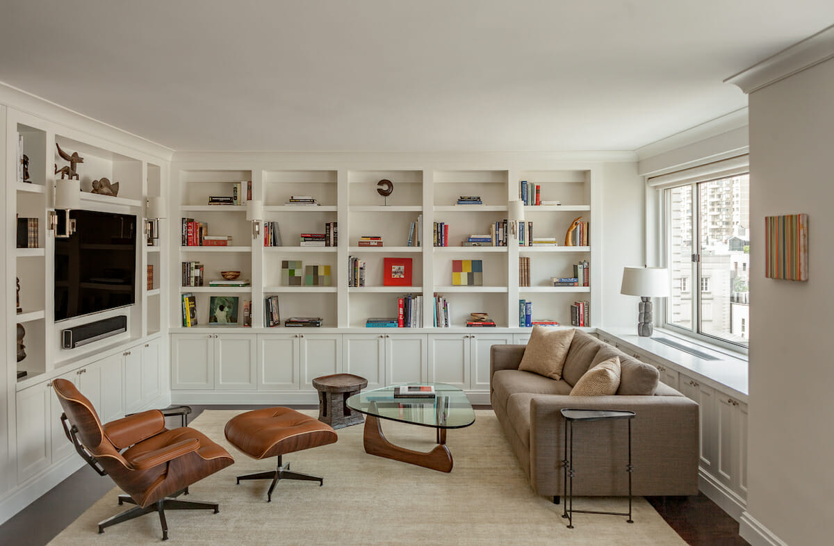 Bookshelves with pops of color as dopamine decor by Decorilla designer, Leonora M.
