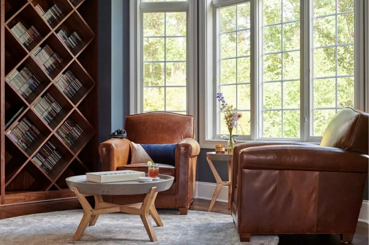Home lirary design with leather chairs and wood shelves