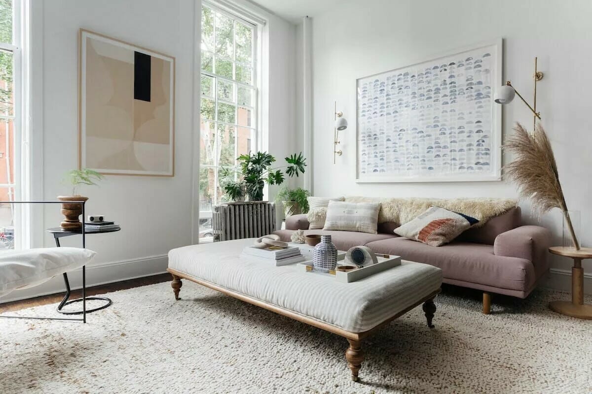 bohemian inspired living room with a pink sofa