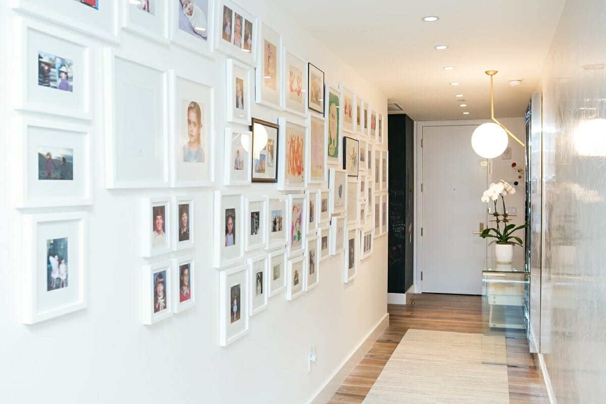Family picture wall ideas with artwork in a hallway