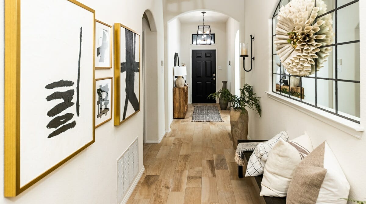 Hallway gallery ideas with artwork and a mirror