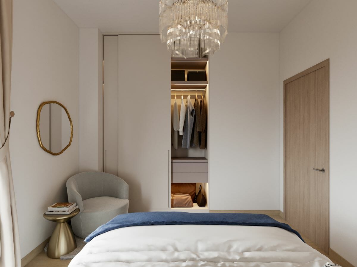 Grey, navy, and gold bedroom accessories in a classy layout by Decorilla