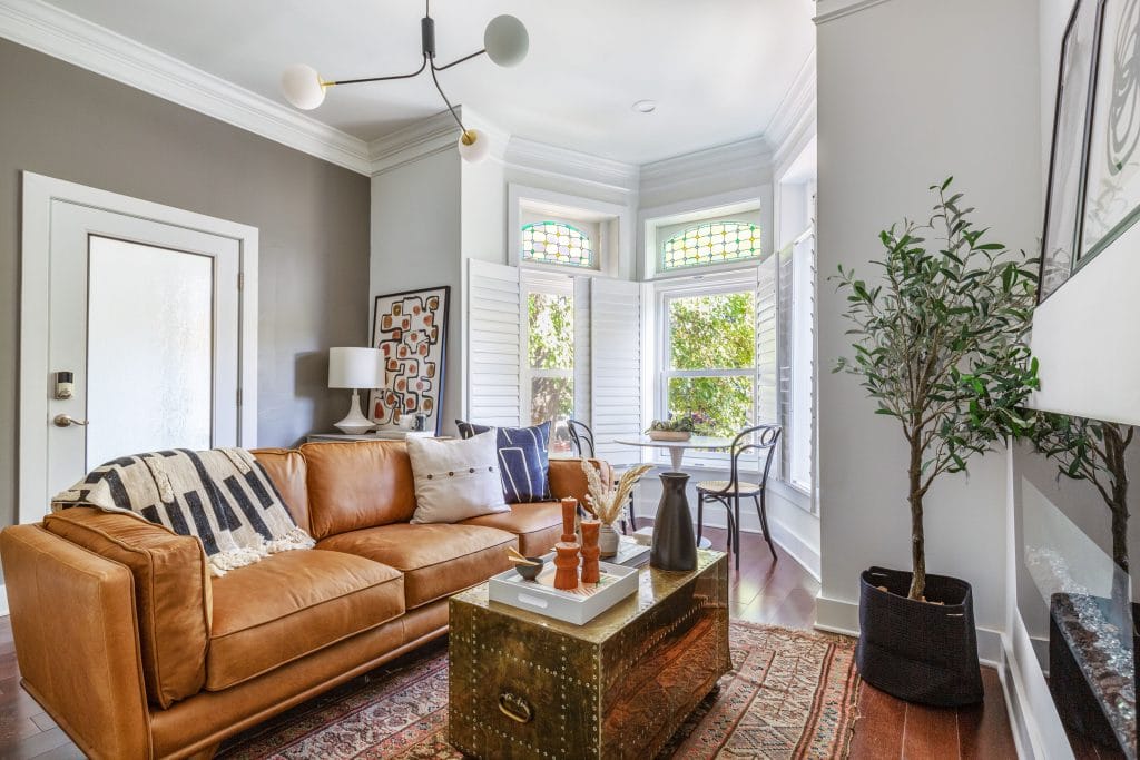 Modern Spanish decor elements in a small living room by Decorilla designer, Megan W.