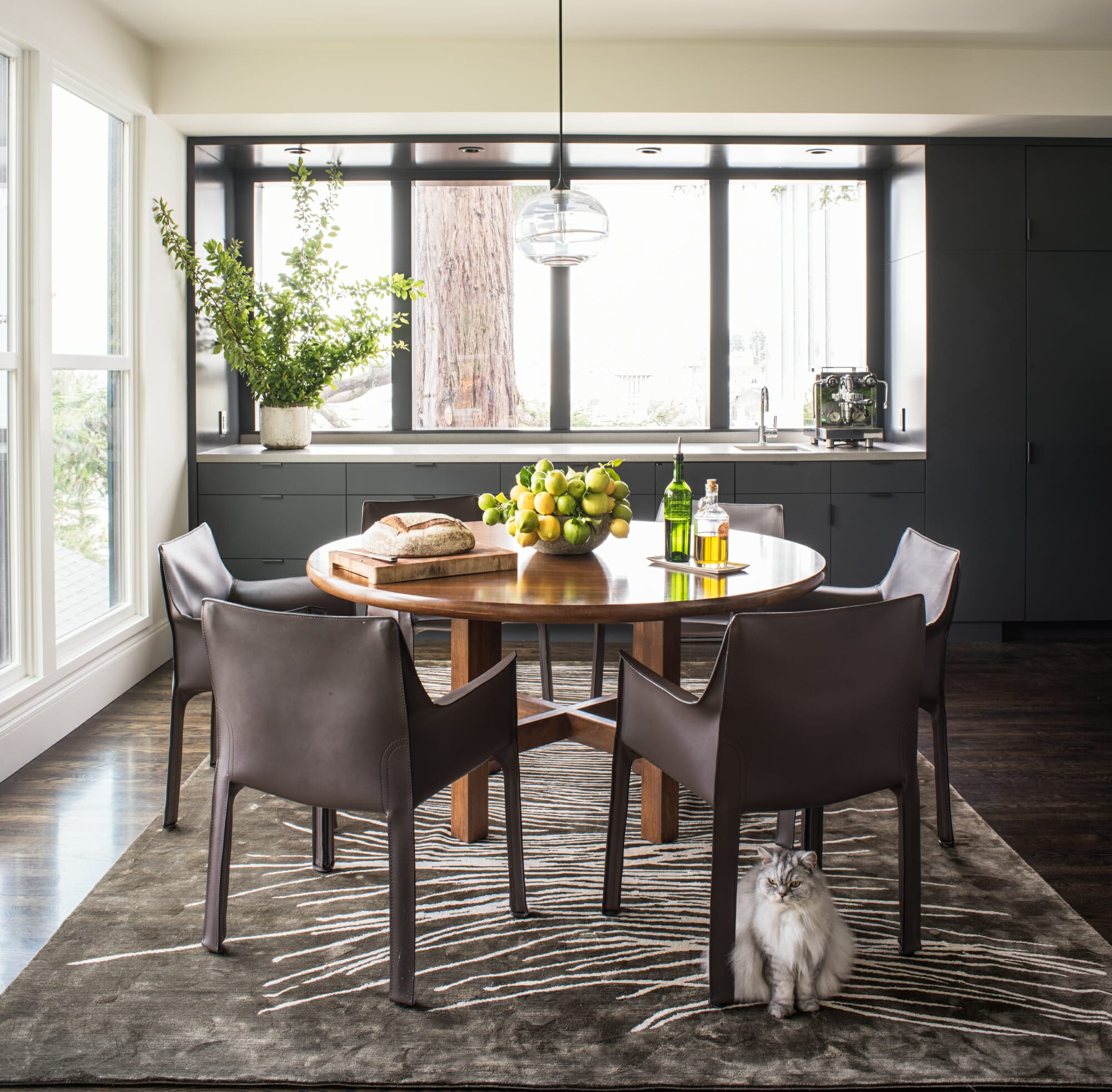 Creative dining table decor in an interior by Decorilla designer, Tiara M.