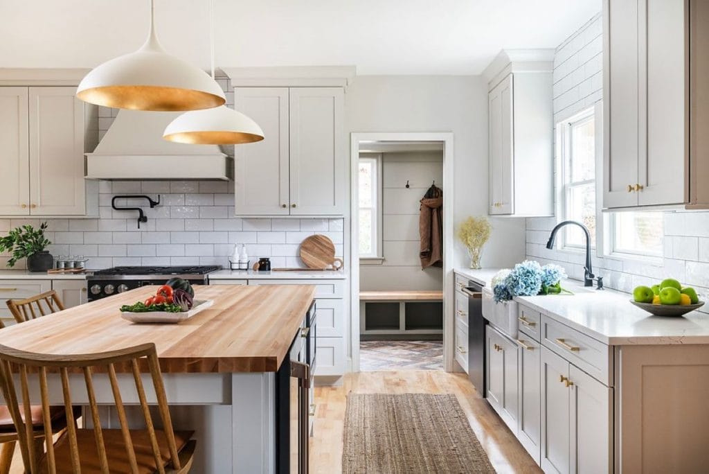 White kitchen with butcherblock countertop ideas by Decorilla