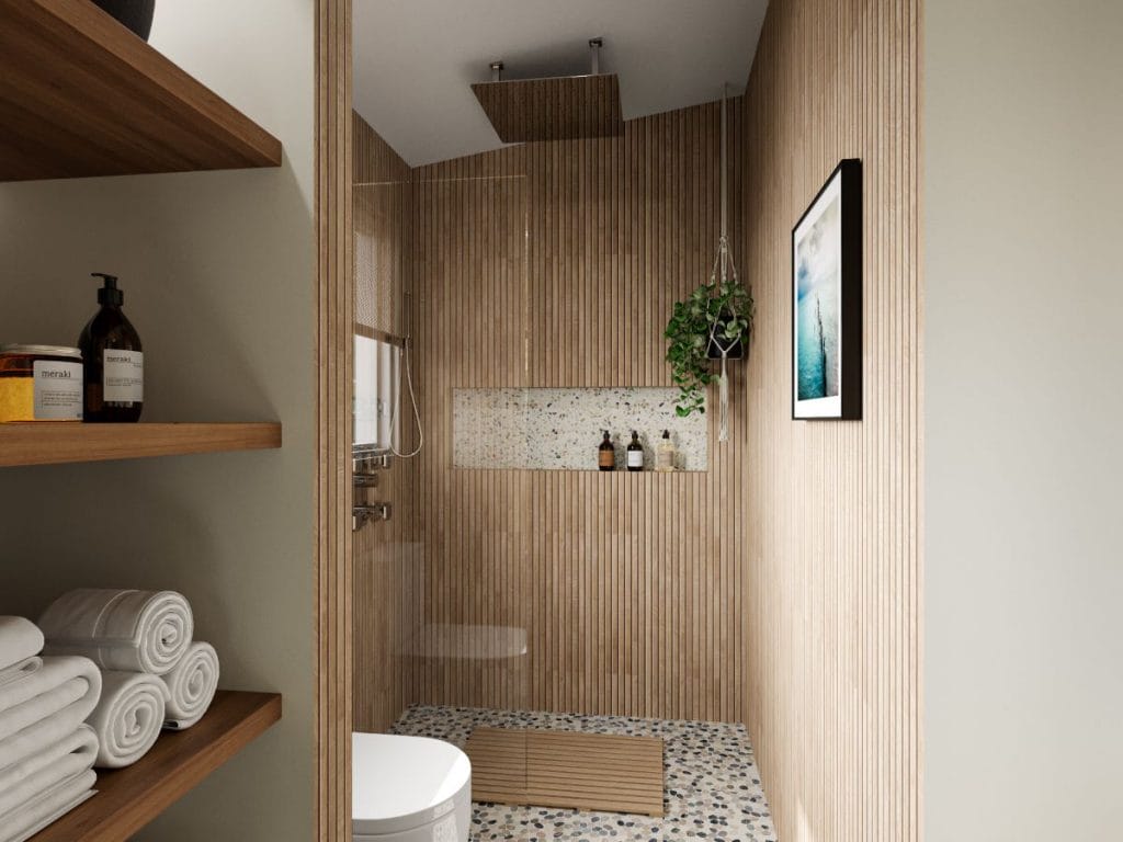 A sleek walk-in shower in the tropical bathroom by Decorilla
