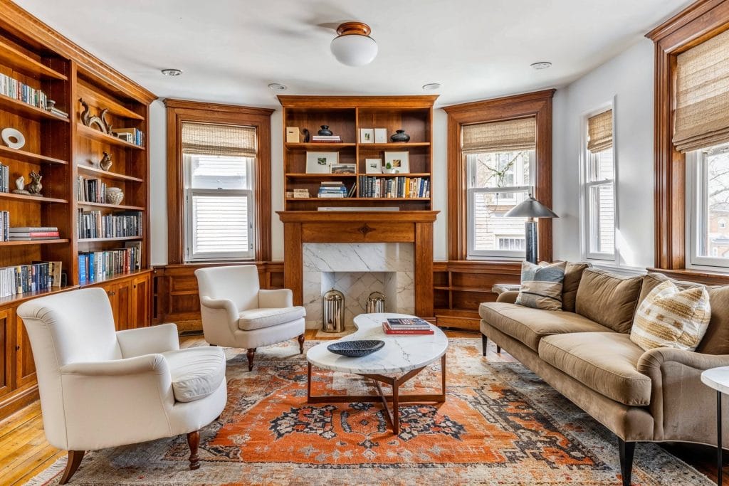 Organic texture of a wooden built-in library characterizing the family room by Decorilla