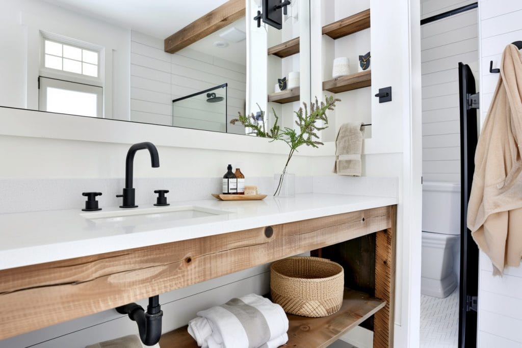 Space-saving bathroom storage solutions under the sink by Decorilla