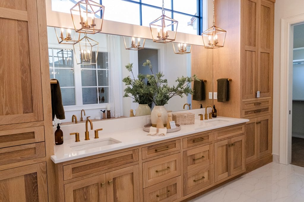 Decorative and functional bathroom storage design by Decorilla designer, Sharene M. 