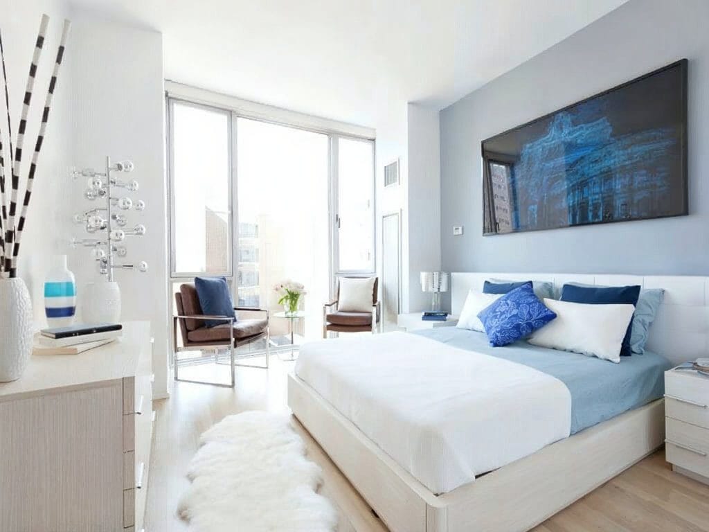 Primary bedroom ideas with a cozy and stylish seating area by Decorilla designer, Joyce T.