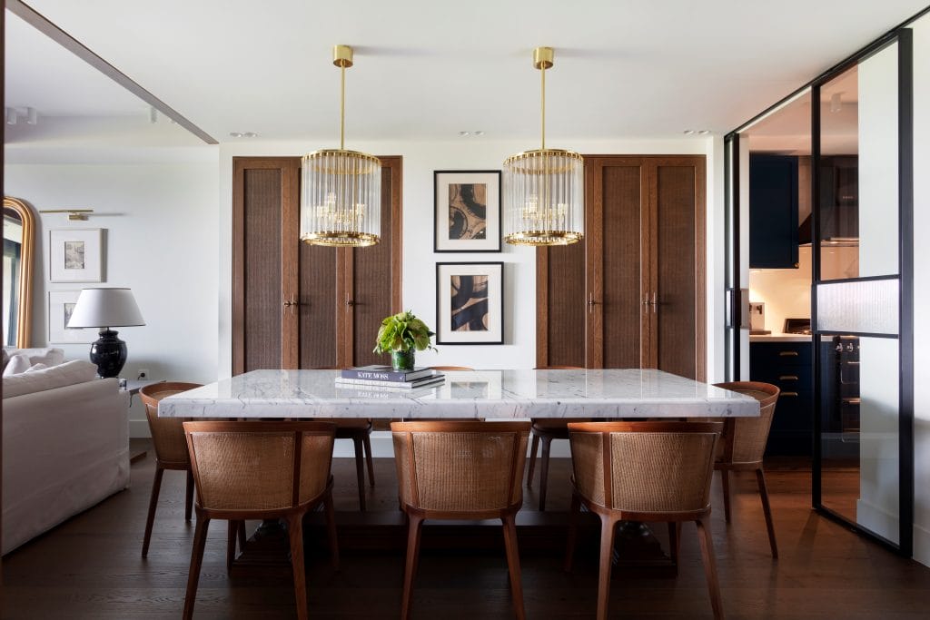 Modern neutral interior design ideas in a dining room by Decorilla designer, Meric S.