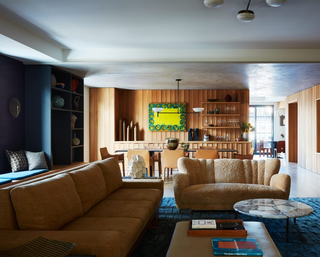 Dark brown couch in a living room by Decorilla designer, Jonathan K.