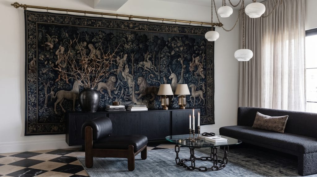 Calm eclectic living room interior design with a statement tapestry, by Decorilla