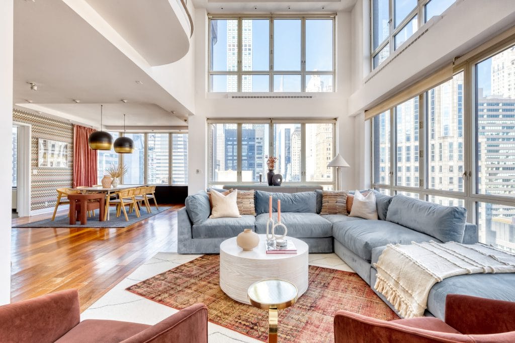 Contemporary eclectic condo living room interior by Decorilla designer, Megan W.