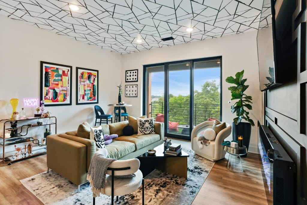 Eclectic living room interior design with statement art, by Decorilla designer, Marve M.