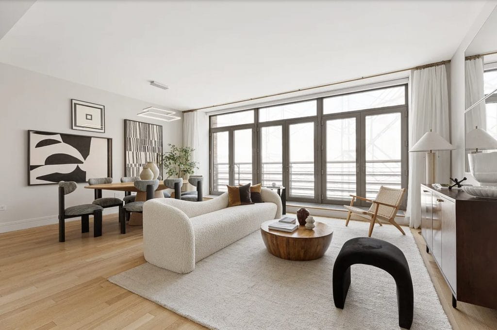 Eclectic living room with different wood tones by DECORILLA designer, Leanna S.