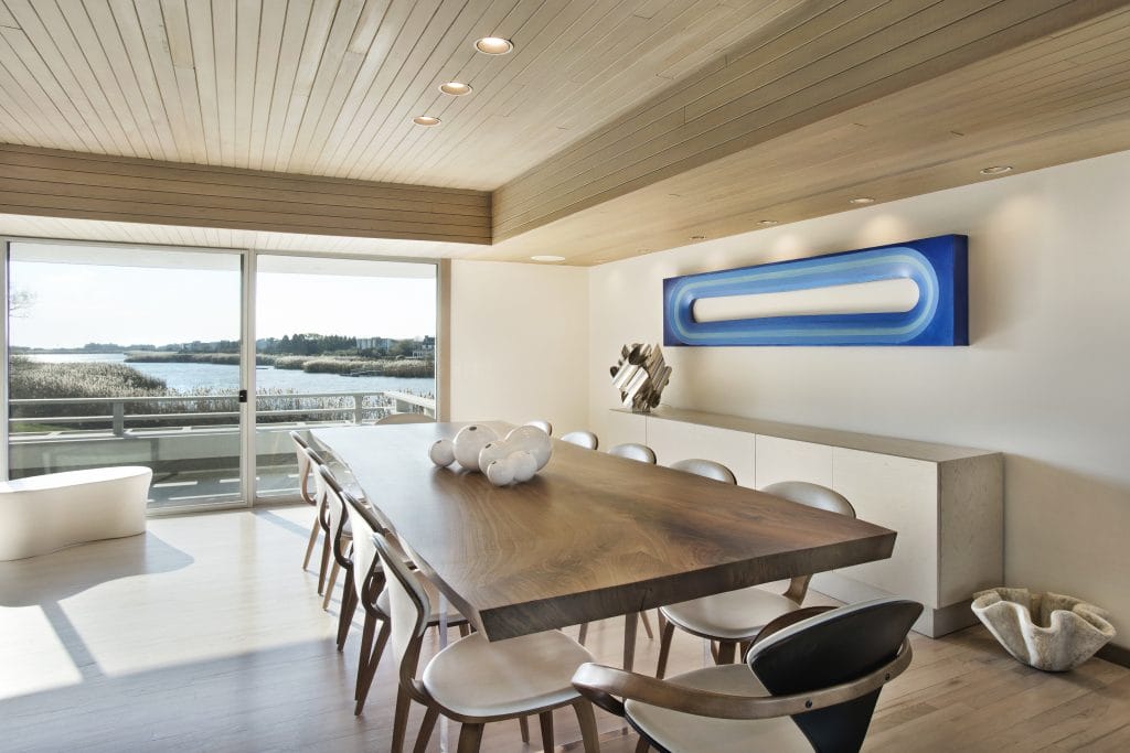 Modern dining room with mixed wood tones by Decorilla designer, Peter C. 