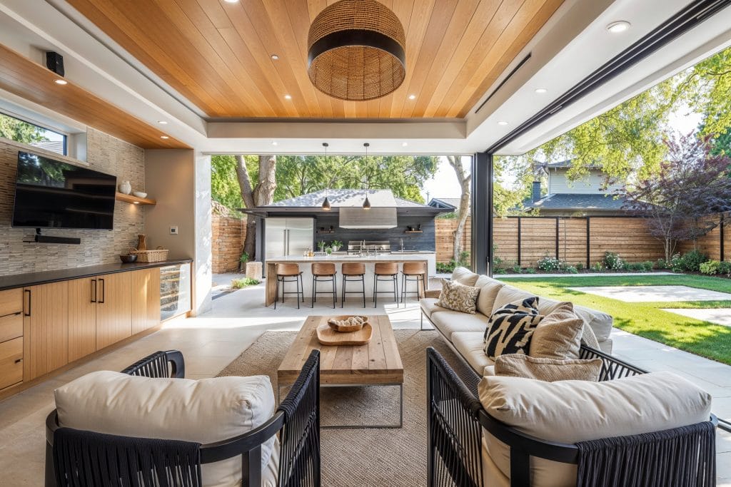 Outdoor decorating ideas with layered lighting in a backyard by Decorilla