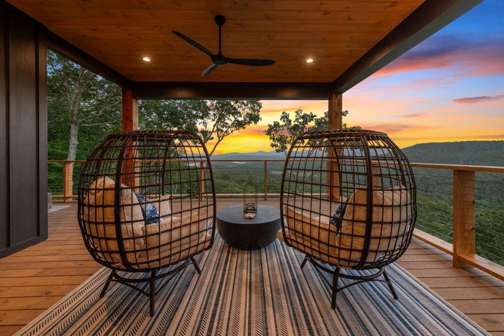Outdoor space design featuring one of the best striped outdoor rugs, by Decorilla designer, Jason D.