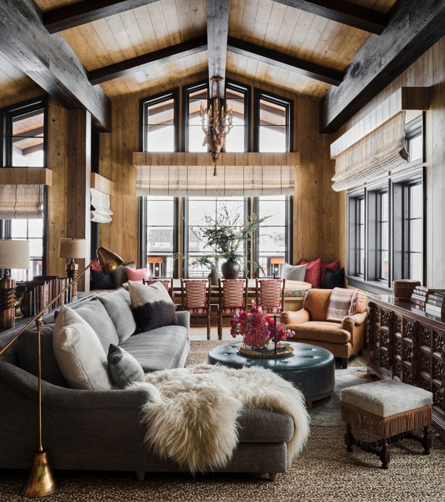 Rustic living room with a vaulted wood accent celing by DECORILLA designer Jamie M
