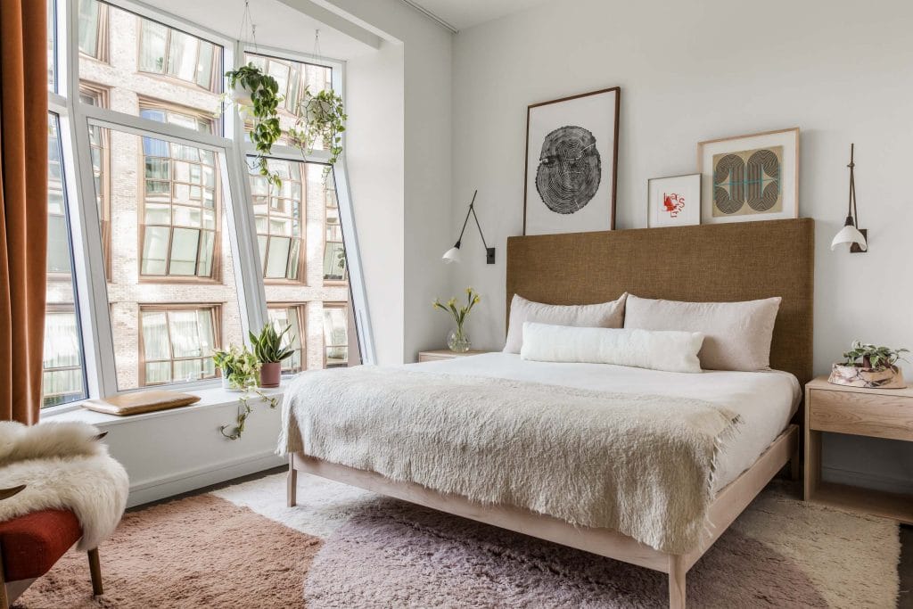 Eclectic bedroom illustrating where to place a bed by DECORILLA designer, Jonathan K.