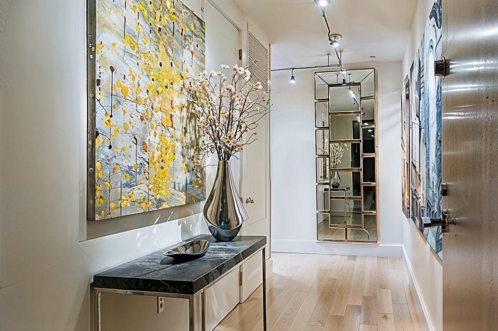 Modern apartment decor in a hallway by Decorilla designer, Jeff D.