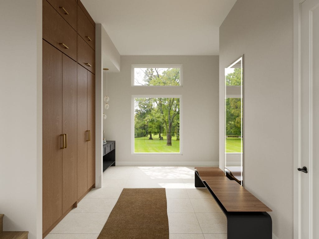 Floor-to-ceiling storage in a seamless modern minimalist entryway interior by Decorilla