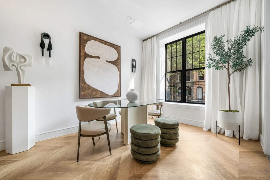 Modern dining room design with herringbone flooring patterns by DECORILLA designer, Leanna S. 