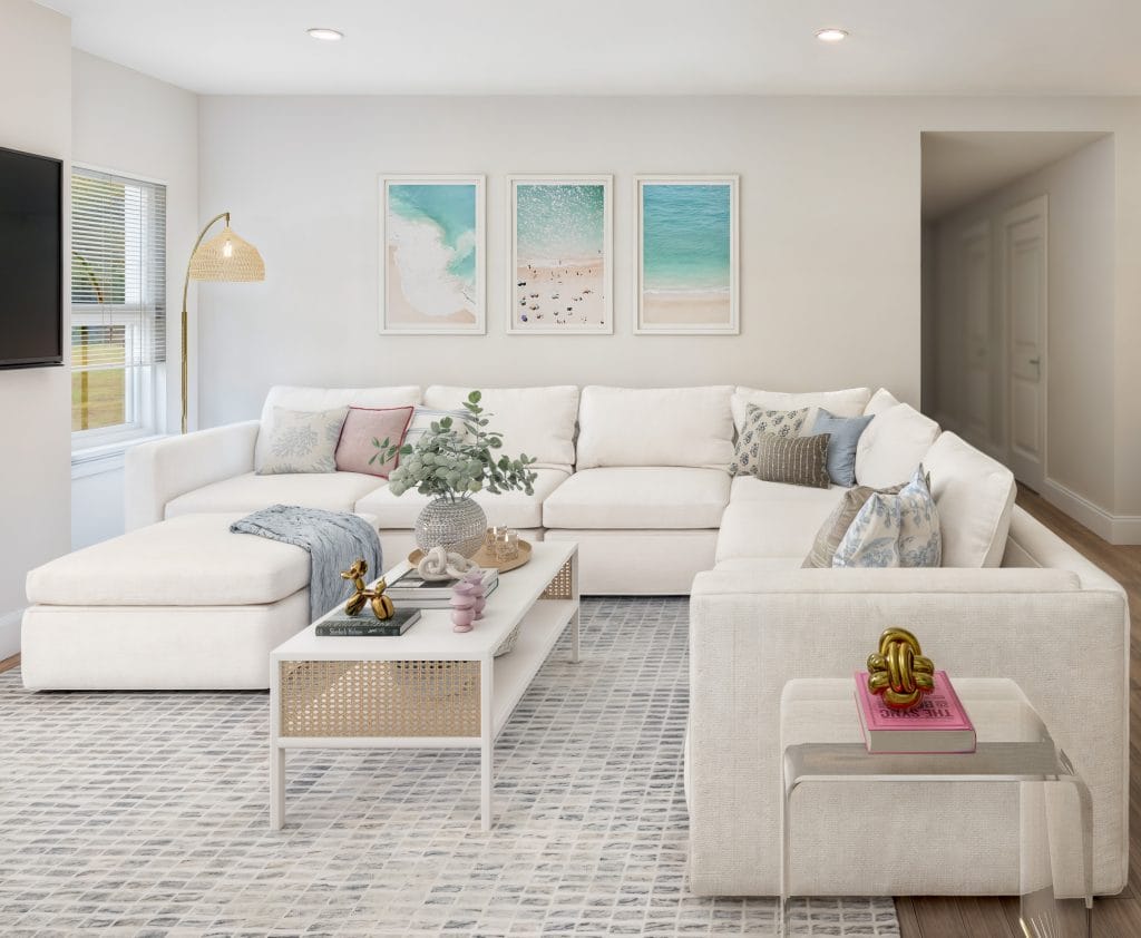 Modern coastal living room in a feminine decorating style by DECORILLA designer, Lara D. 