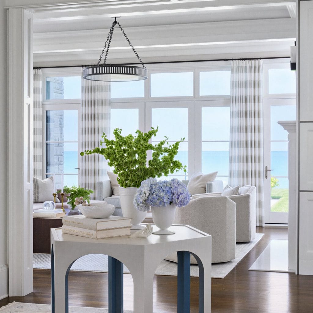 Coastal living room vignette with some best Mother's Day gift ideas by Decorilla designer, Samantha R.