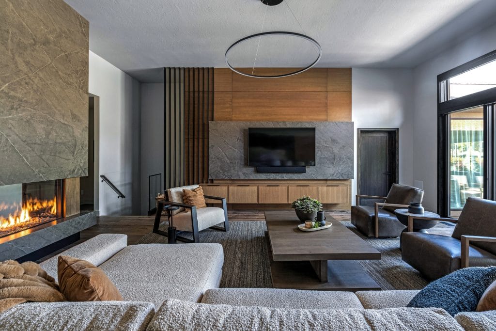 Modern living room with gas fireplace by Decorilla designer Danielle E