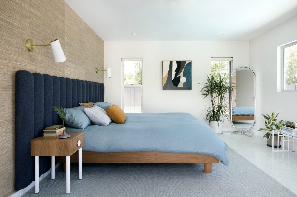 Modern bedroom in a colorful minimalist home by DECORILLA designer Jamie M.