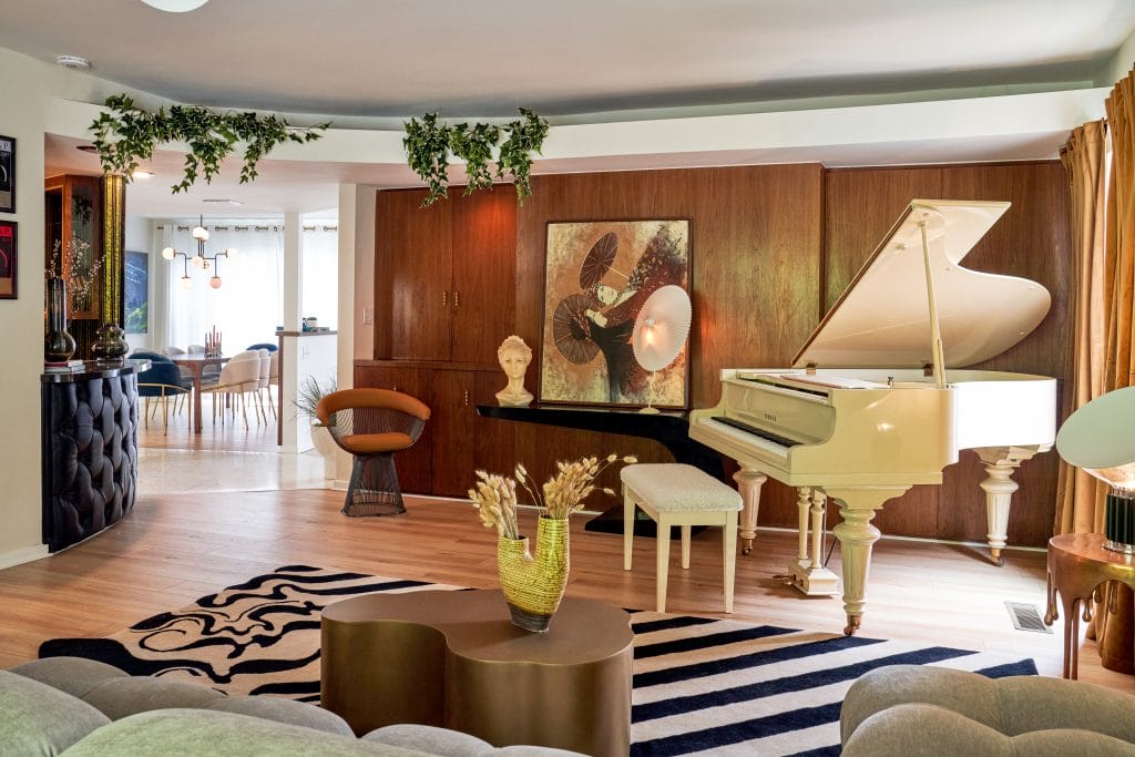 Modern living room with wooden wall by DECORILLA designer Galina H