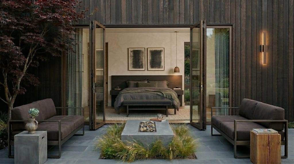 Scandi master bedroom patio featuring the best outdoor side tables by Decorilla