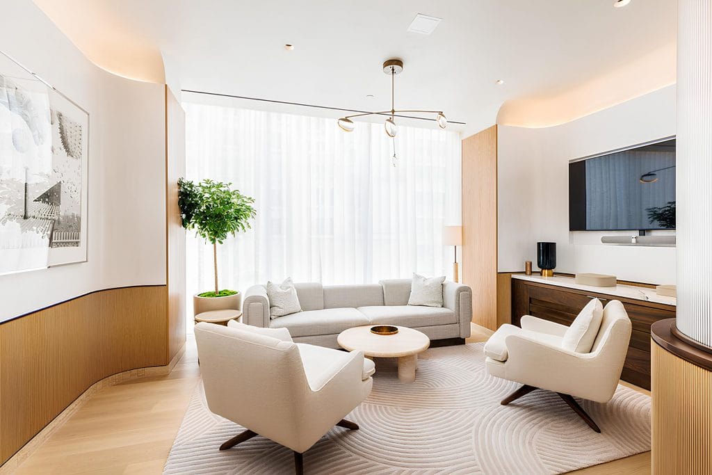 Transitional living room with decorative wood wall panels by DECORILLA designer Molly I.