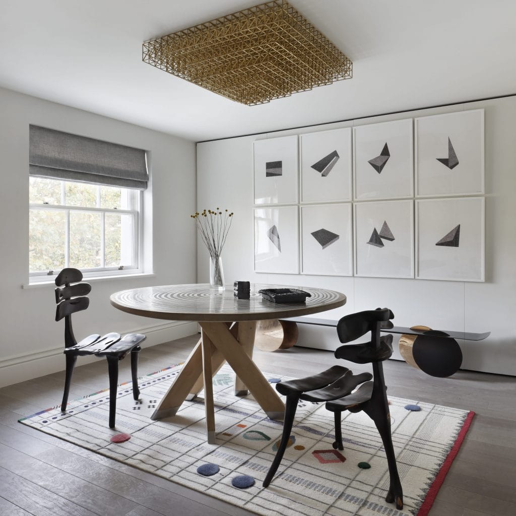 Personalized dining room with a cohesive gallery wall, by Decorilla designer, Catherine W.