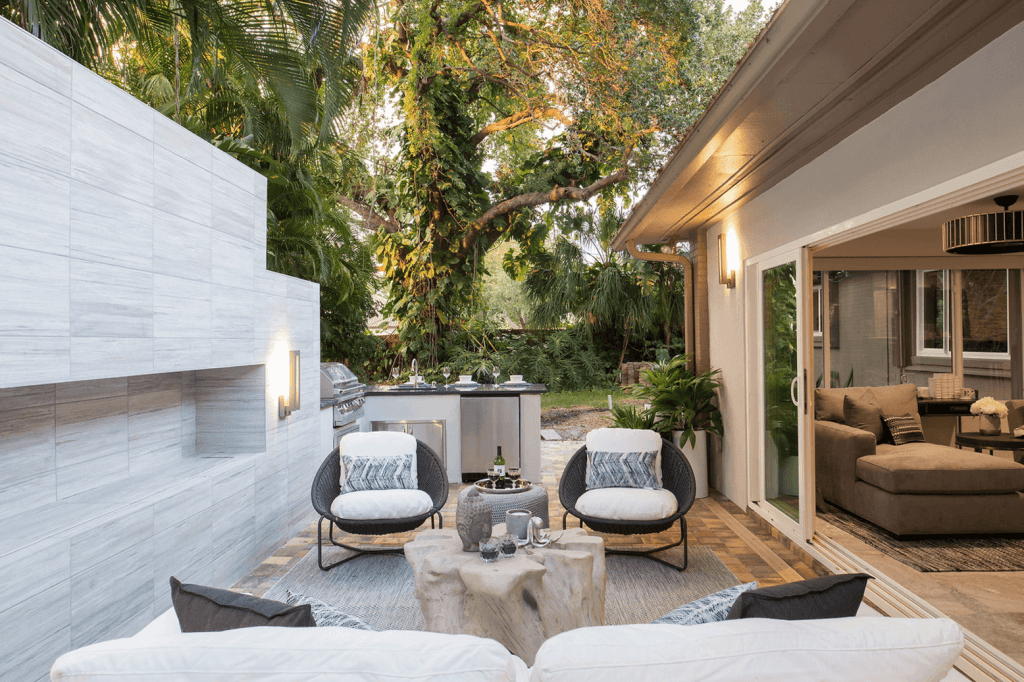 Contemporary sconces reflecting lighting trends in a patio by Decorilla designer, Stella P.