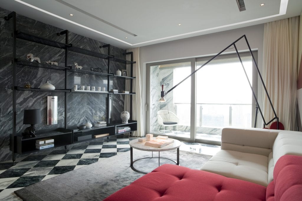 Integrated lighting and sculptural lamps in a modern living room by Decorilla designer, Sergio M.