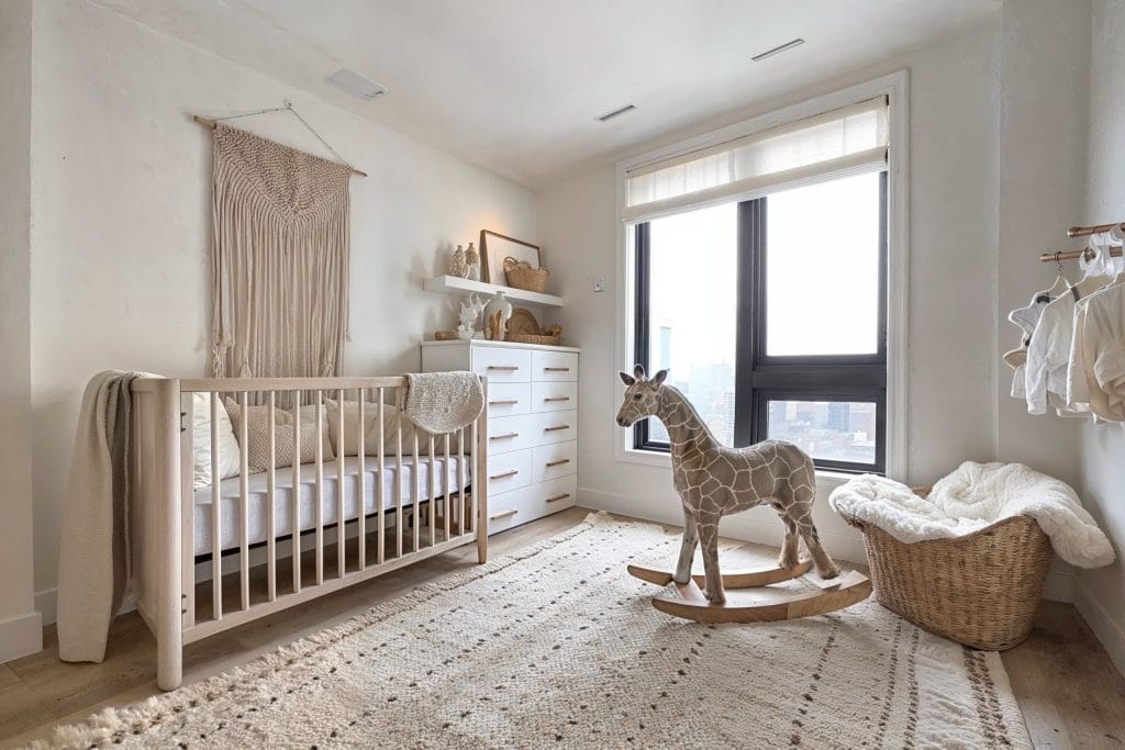 Jungle nursery decorative items in a boho interior by Decorilla