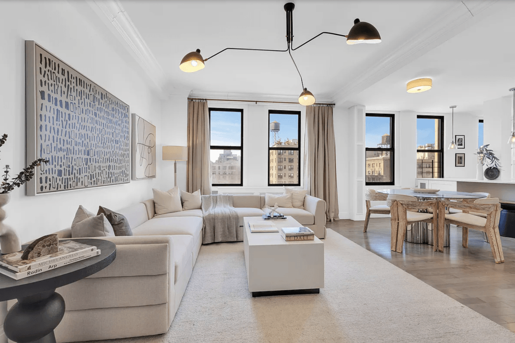 Layered lighting in a contemporary living room by Decorilla designer, Leanna S.