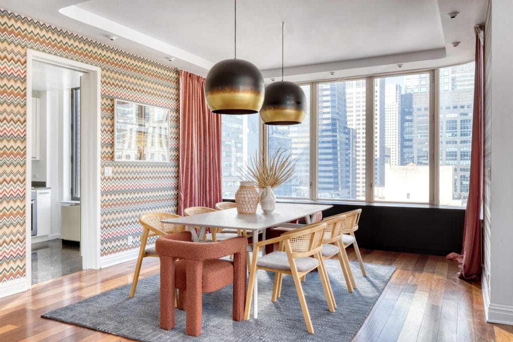 Lighting trends in a dining room interior by Decorilla designer, Megan W.