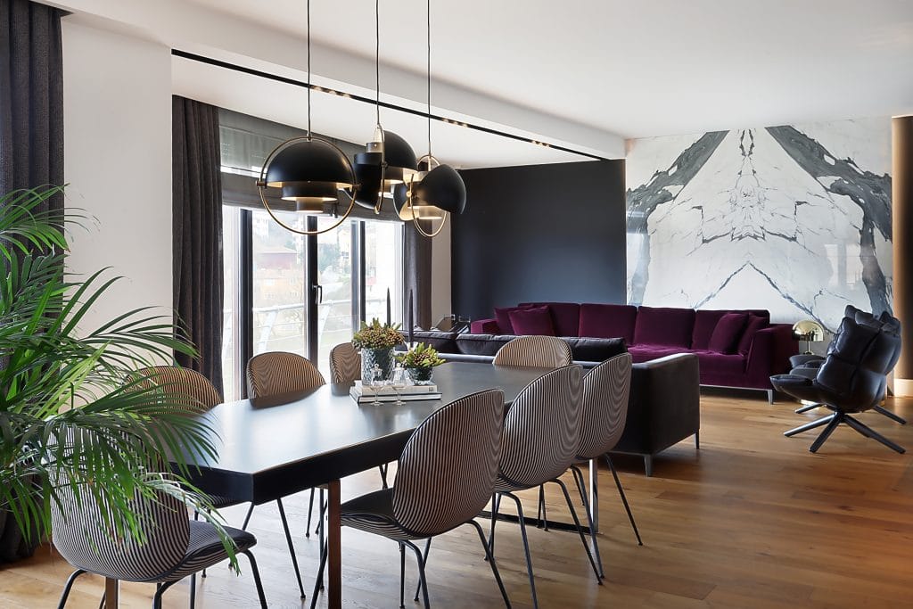 Sculptural chandeliers in a dining room by Decorilla designer, Meric S.